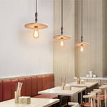 Tavor Disc Pendant Light in Natural Travertine with Walnut Accent