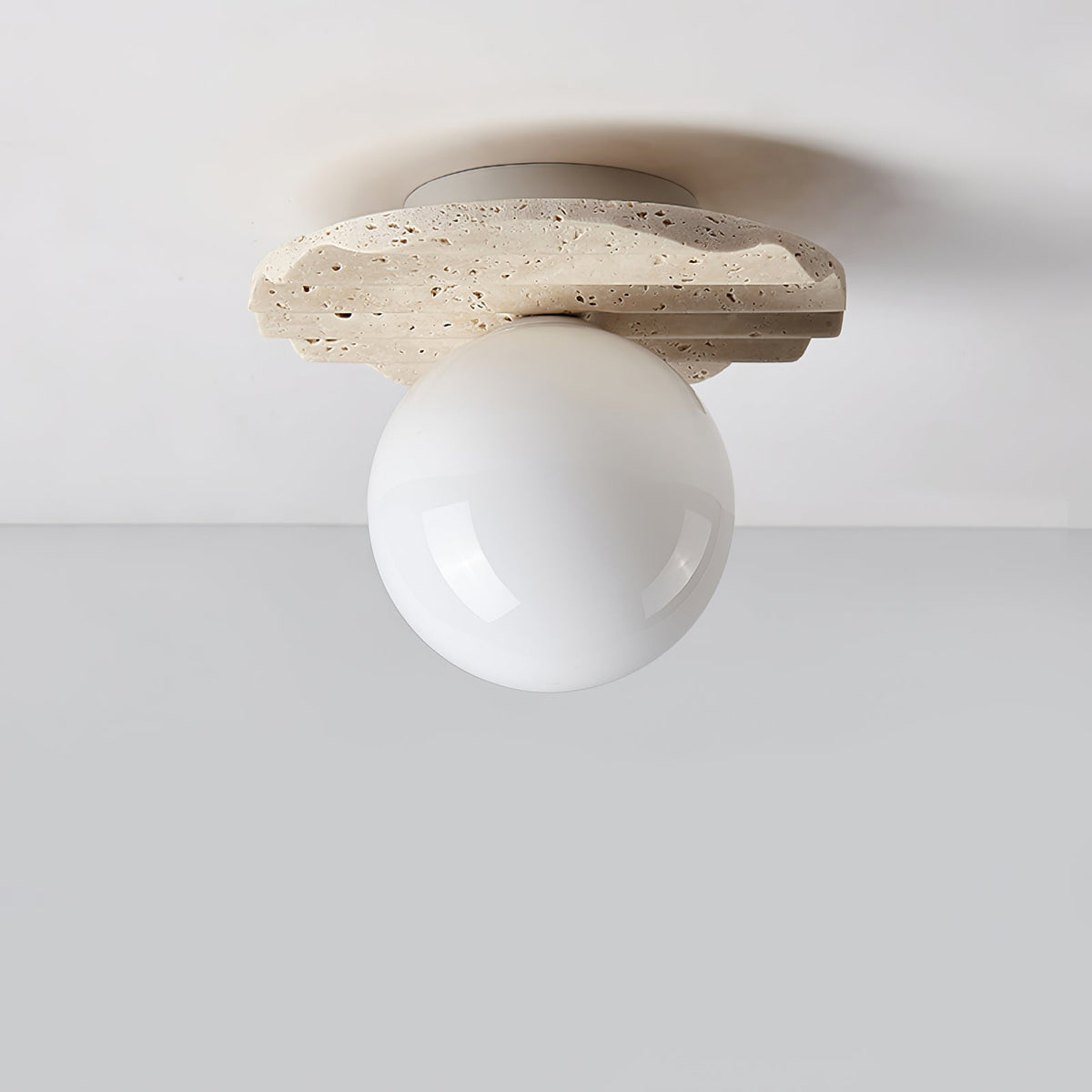 Terra Globe Ceiling Light in Hand-Chiseled Travertine with Opal Glass Shade