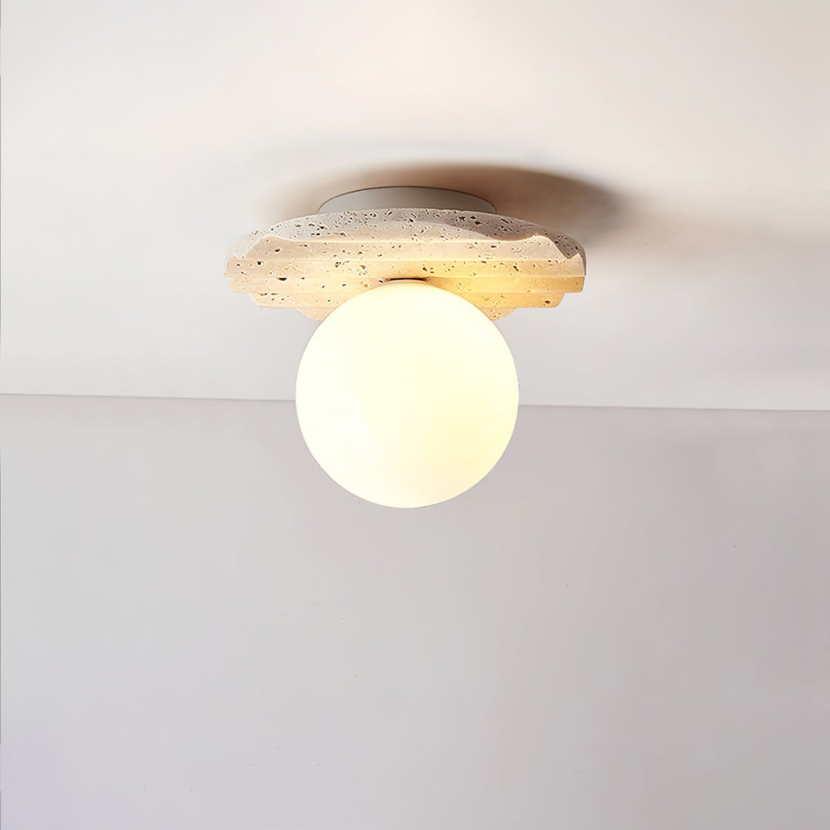 Terra Globe Ceiling Light in Hand-Chiseled Travertine with Opal Glass Shade