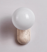 Travertine Pebble Wall Sconce with Opal Glass Globe for Modern Interiors
