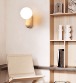 Travertine Pebble Wall Sconce with Opal Glass Globe for Modern Interiors