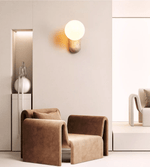 Travertine Pebble Wall Sconce with Opal Glass Globe for Modern Interiors