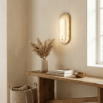 Travertine Pill Wall Sconce with Alabaster Glow and Aged Brass Accents