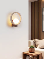 Travira Orbit Wall Sconce in Natural Travertine and Walnut