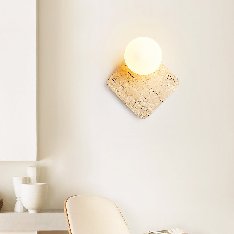 Travora Globe Wall Sconce in Natural Travertine with Opal Glass Shade