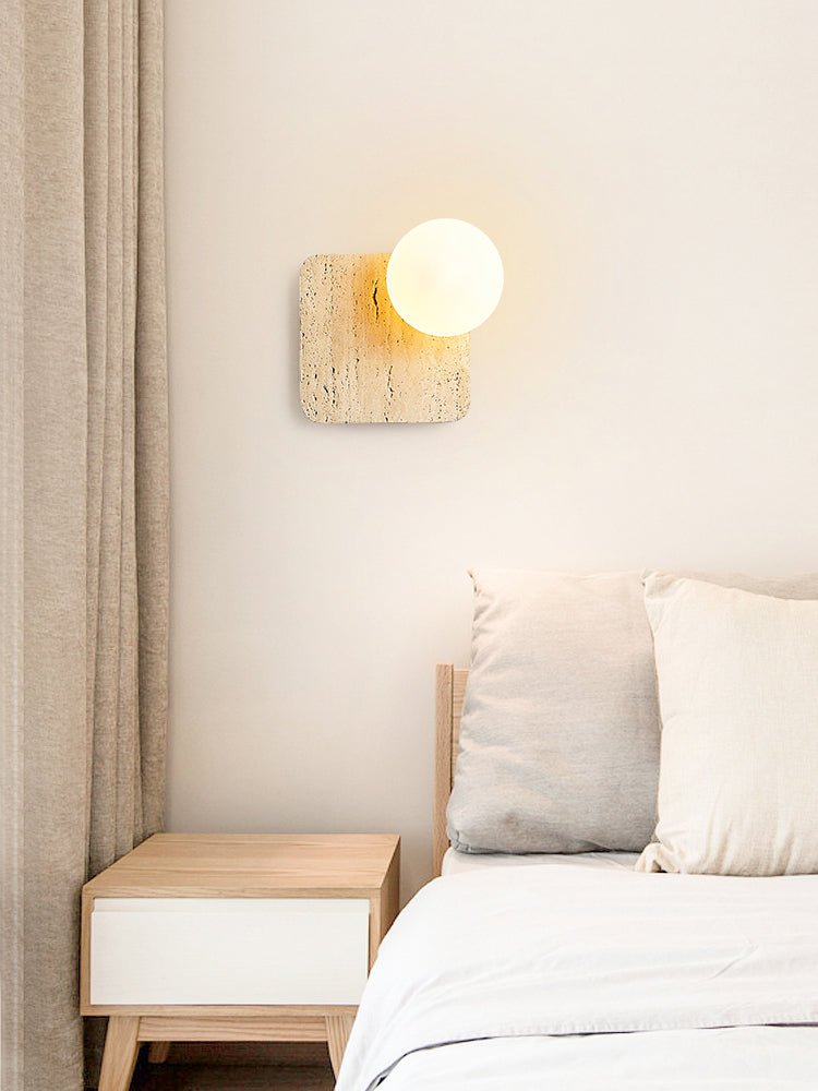 Travora Globe Wall Sconce in Natural Travertine with Opal Glass Shade