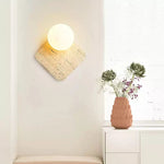 Travora Globe Wall Sconce in Natural Travertine with Opal Glass Shade