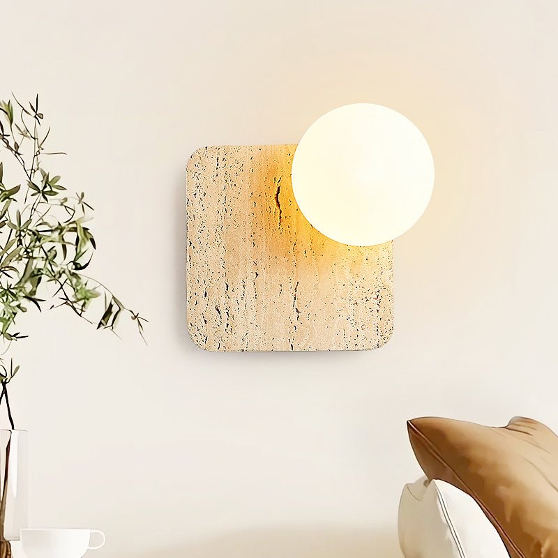 Travora Globe Wall Sconce in Natural Travertine with Opal Glass Shade