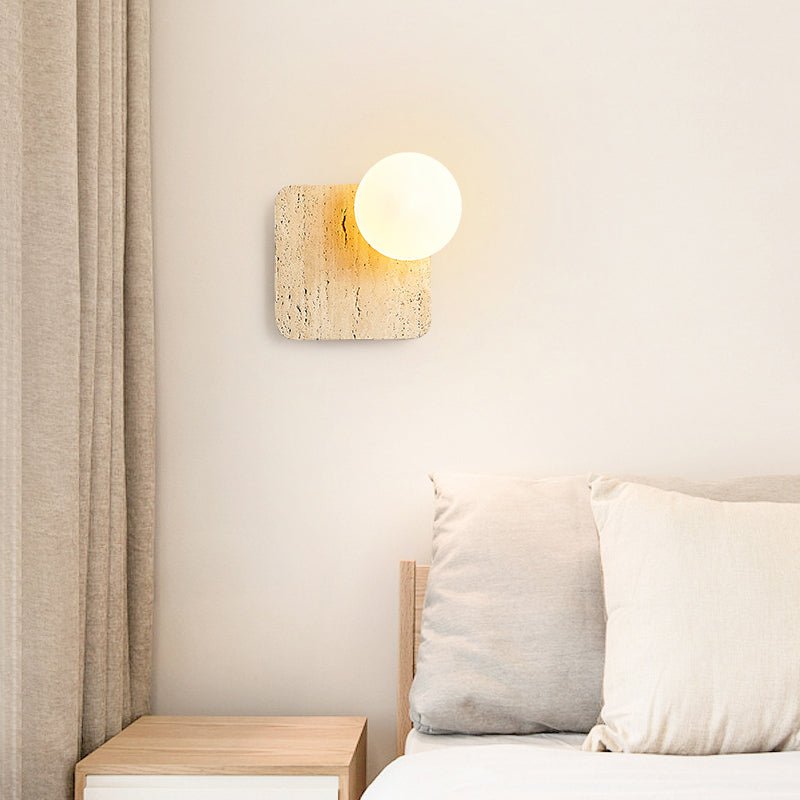 Travora Globe Wall Sconce in Natural Travertine with Opal Glass Shade