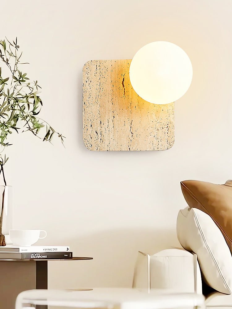 Travora Globe Wall Sconce in Natural Travertine with Opal Glass Shade