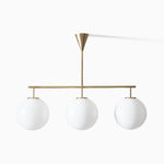 Trilo Globe Pendant Light – Three Opal Glass Spheres on a Sleek Bar