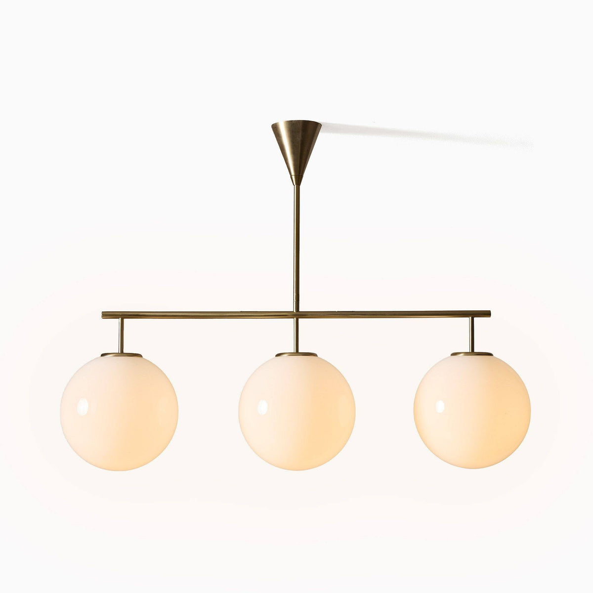 Trilo Globe Pendant Light – Three Opal Glass Spheres on a Sleek Bar