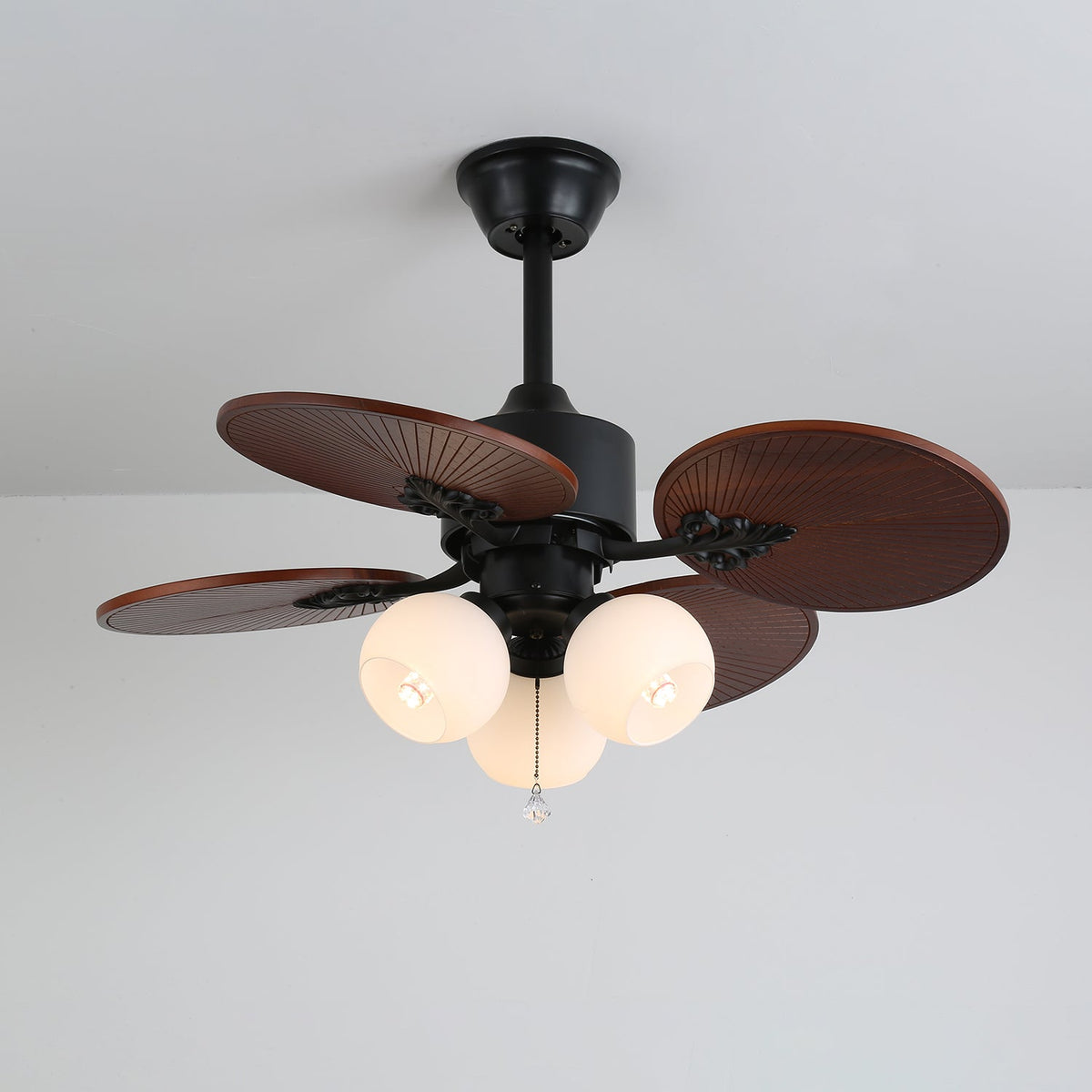 Tropica Breeze Ceiling Fan Light with Palm Blades and Amber Glass