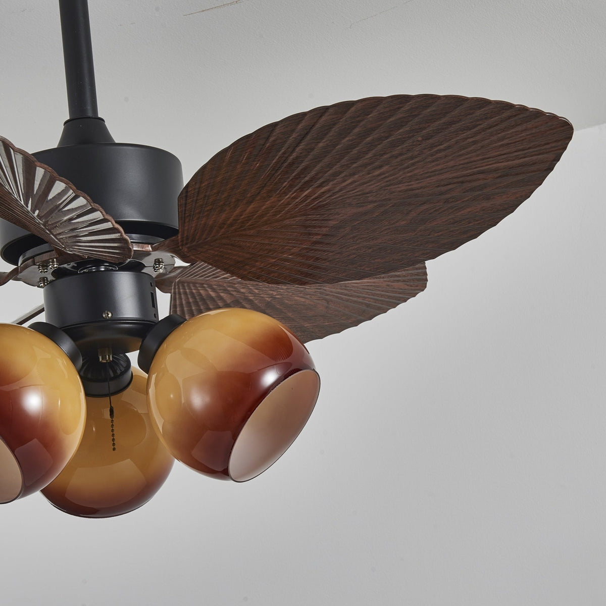 Tropiluxe Ceiling Fan Light with Palm Leaf Blades and Amber Glass Shade