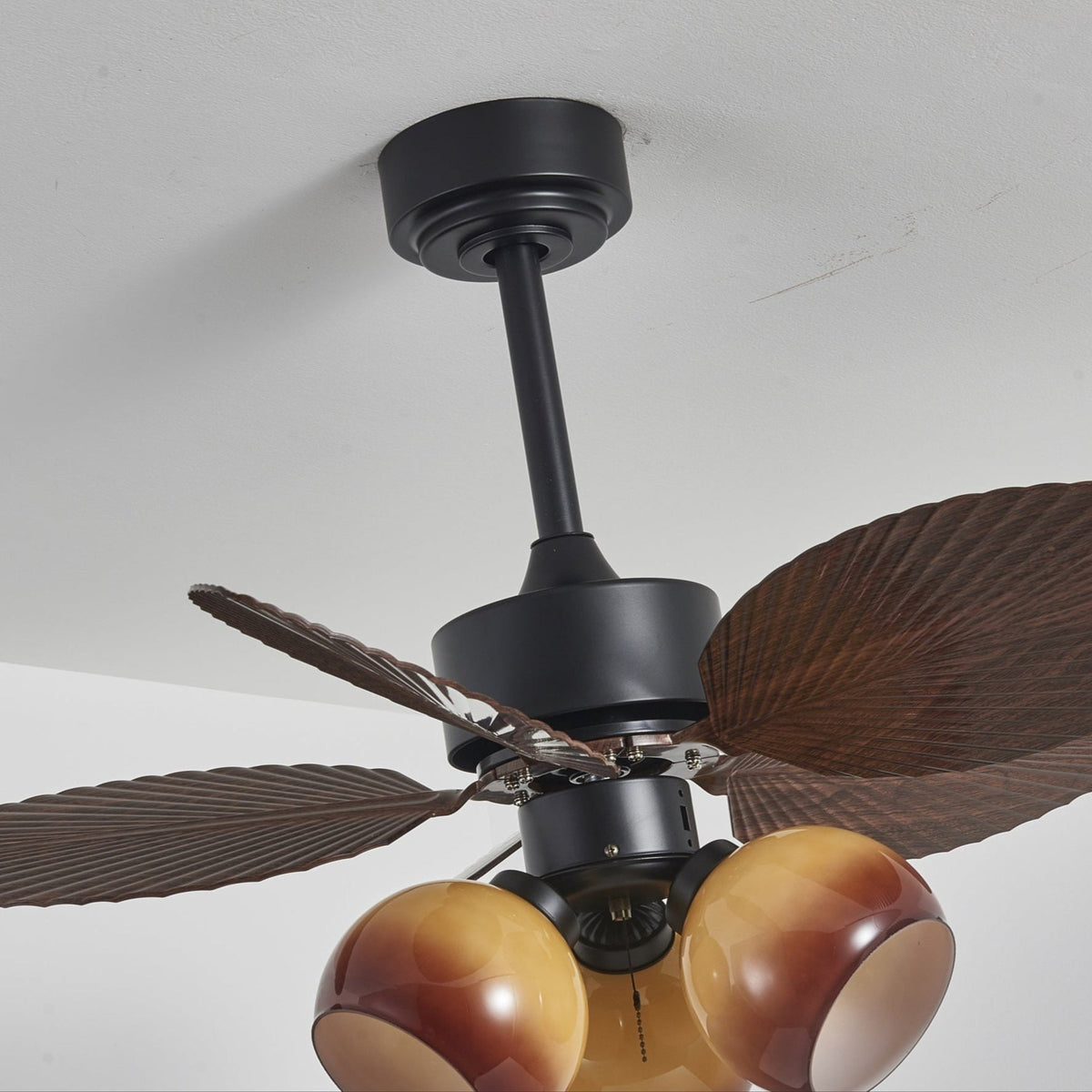Tropiluxe Ceiling Fan Light with Palm Leaf Blades and Amber Glass Shade