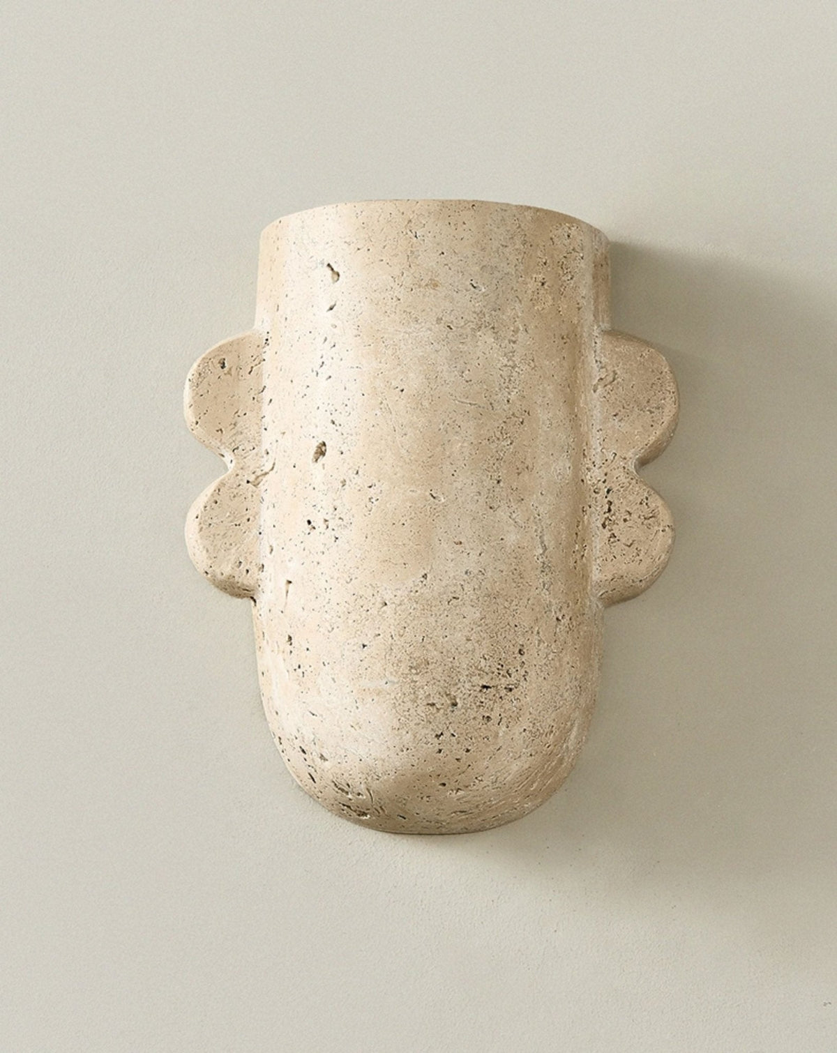 Vaelis Sculptural Travertine Wall Sconce for Modern Interiors