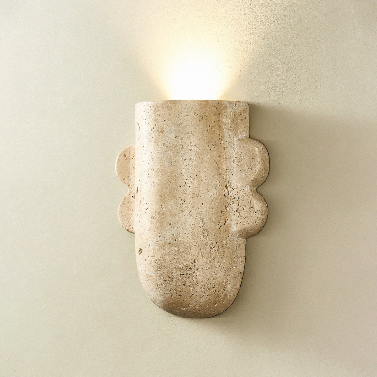 Vaelis Sculptural Travertine Wall Sconce for Modern Interiors