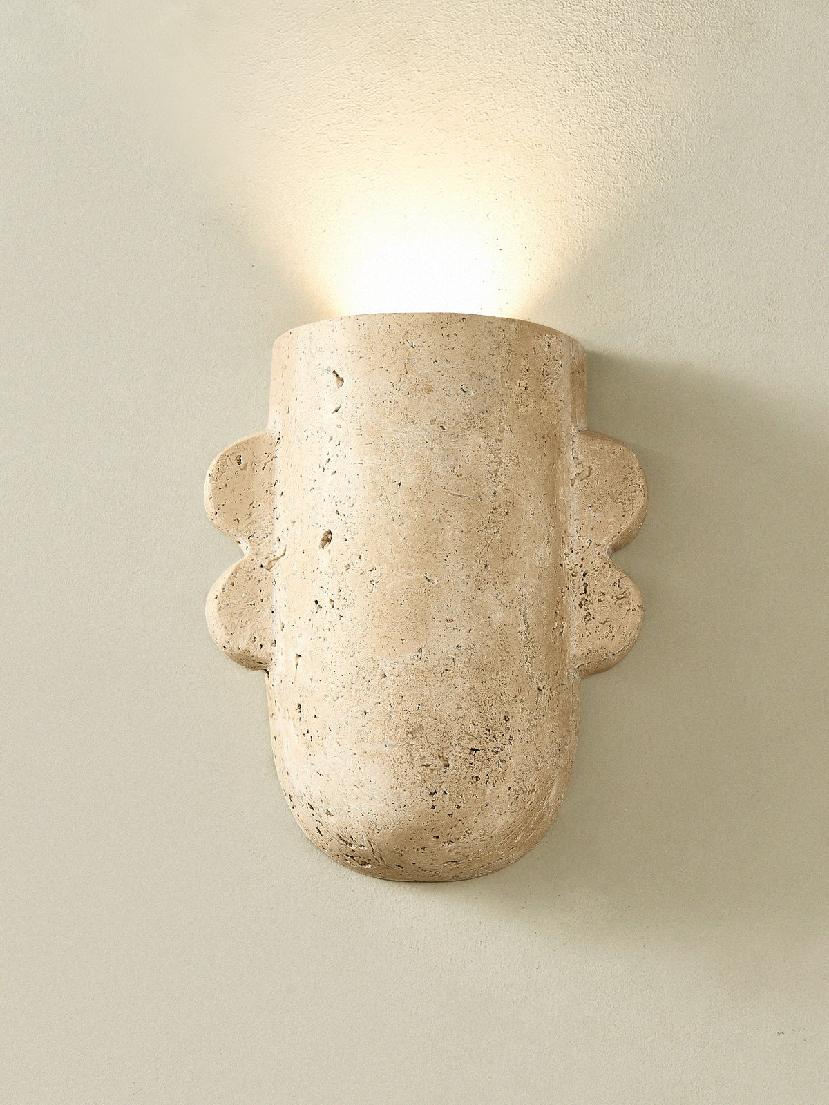 Vaelis Sculptural Travertine Wall Sconce for Modern Interiors