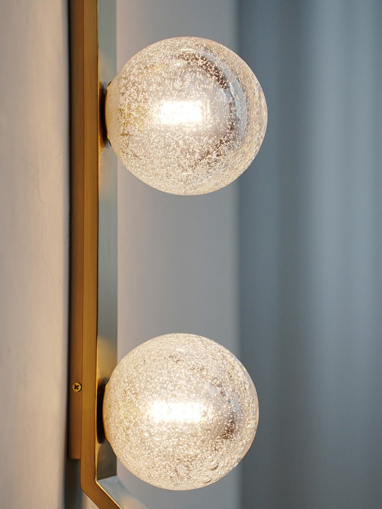 Vertical Balls Bar Wall Sconce in Gold with Clear Glass Globes
