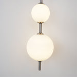 Vertical Globe Plug In Wall Lamp