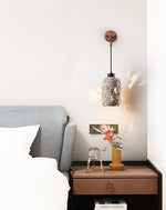 Volcanic Glow Travertine Wall Sconce with Walnut Accent