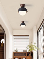 Volcanic Orb Flush Mount Ceiling Light in Black Travertine and Opal Glass