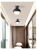 Volcanic Orb Flush Mount Ceiling Light in Black Travertine and Opal Glass