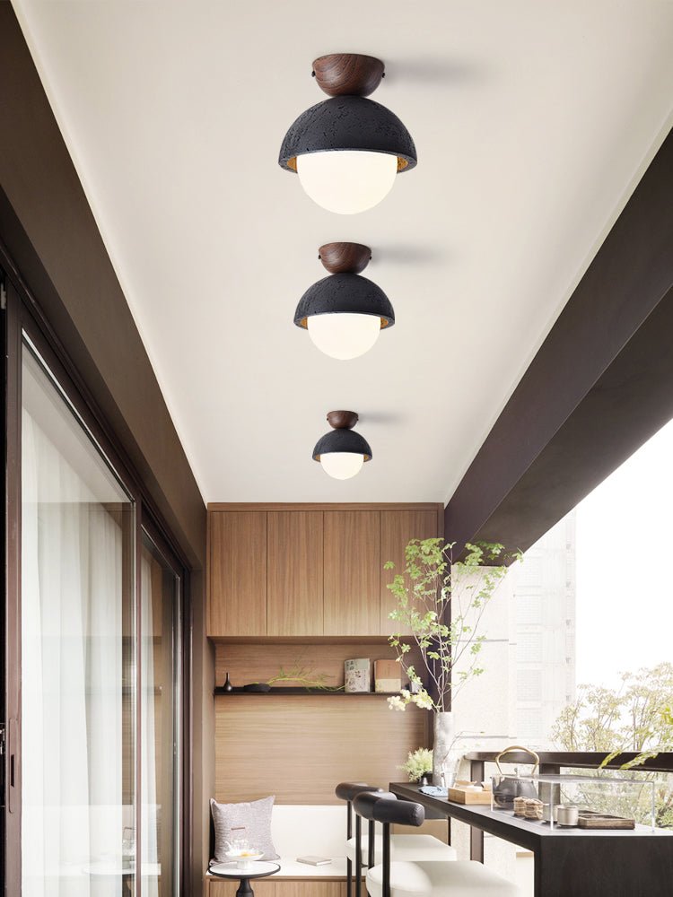 Volcanic Orb Flush Mount Ceiling Light in Black Travertine and Opal Glass