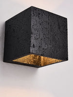 Vulcanis Cube Wall Sconce in Black Travertine with Golden Interior