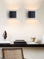 Vulcanis Cube Wall Sconce in Black Travertine with Golden Interior