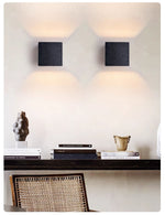 Vulcanis Cube Wall Sconce in Black Travertine with Golden Interior