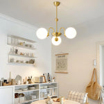 Yisu Brass Chandelier – Vintage Glass Globe Pendant Light for Modern Interiors
