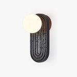 Eventide Orb Wall Sconce in Black Travertine with Opal Glass Globe