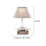 French Perched Bird Table Lamp on Stacked Books, Beige Fabric Shade
