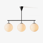 Trilo Globe Pendant Light – Three Opal Glass Spheres on a Sleek Bar