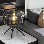 Nordic Glass Table Lamp with Four-Legged Iron Base for Modern Interiors