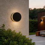 Modern Round Outdoor Wall Sconce in Black Stainless Steel with Warm LED Glow