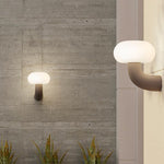 Arc Outdoor Wall Sconce in Black Stainless Steel with Warm LED Glow