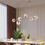 Aurora Linear Glass Globe Chandelier in Gold for Modern Dining Rooms