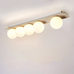 Orélie Modern Travertine Ceiling Light with Frosted Glass Globes