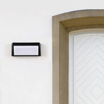 Solar-Powered Minimalist Outdoor Wall Sconce in Sand Black Aluminum