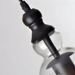 Artisan Iron and Glass Pendant Light with Warm Ambient Glow