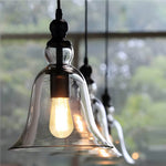 Artisan Iron and Glass Pendant Light with Warm Ambient Glow